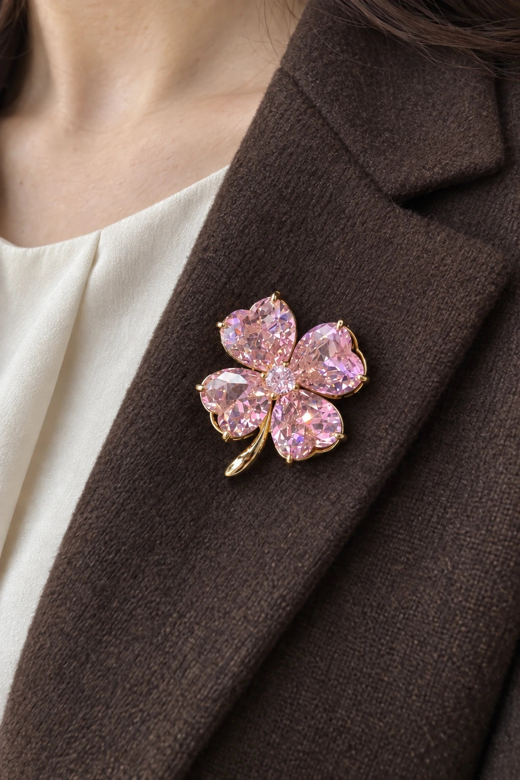 Blush Pink clover brooch worn on a brown wool coat lapel