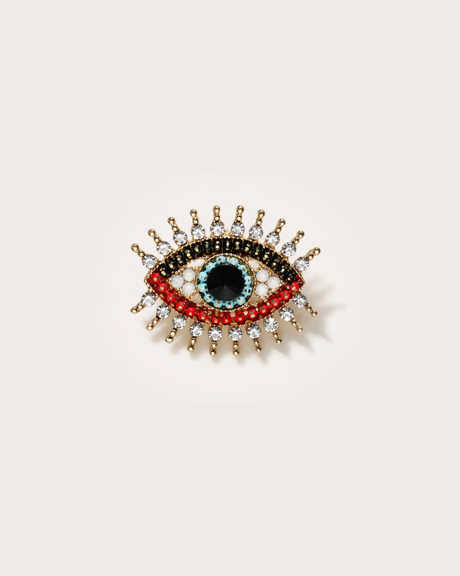 Suoja Multicolor Crystal Eye Brooch on a warm pale studio background with a natural contact shadow