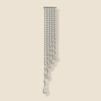 Kajo Crystal Cascade Brooch on an exact warm ivory background
