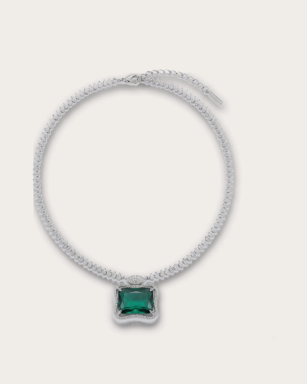 Ruutu emerald-green pendant necklace on a warm neutral background