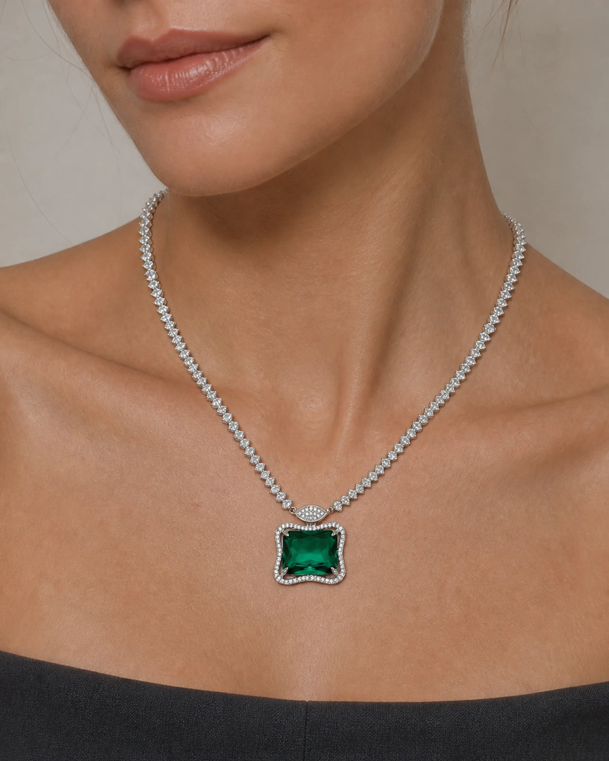 Close neckline view of the Ruutu green pendant necklace