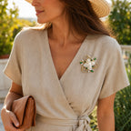 Woman wearing the Eira Pearl Garden Brooch with a linen dress