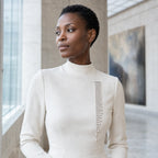 Kajo Crystal Cascade Brooch worn on a tailored lapel in a museum setting
