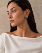Ruutu emerald-green statement earring worn with an ivory boat-neck top