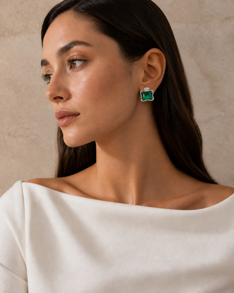 Ruutu emerald-green statement earring worn with an ivory boat-neck top