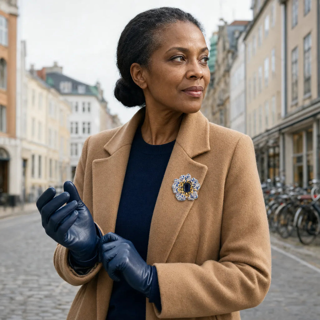 Sini Midnight Bloom Brooch worn on a camel coat outdoors