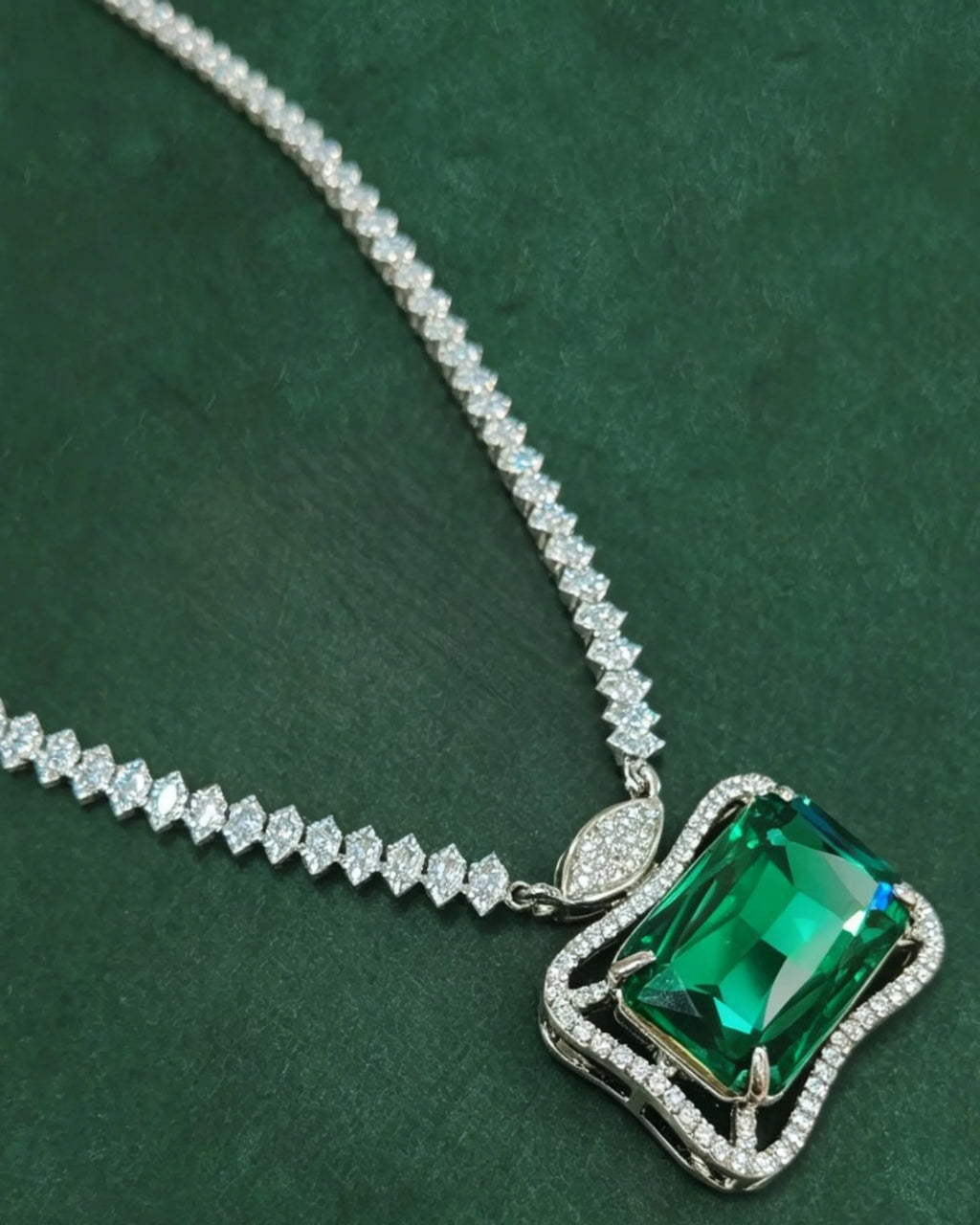 Ruutu green pendant necklace in a deep green still life
