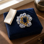 Sini Midnight Bloom Brooch displayed in a navy jewelry box