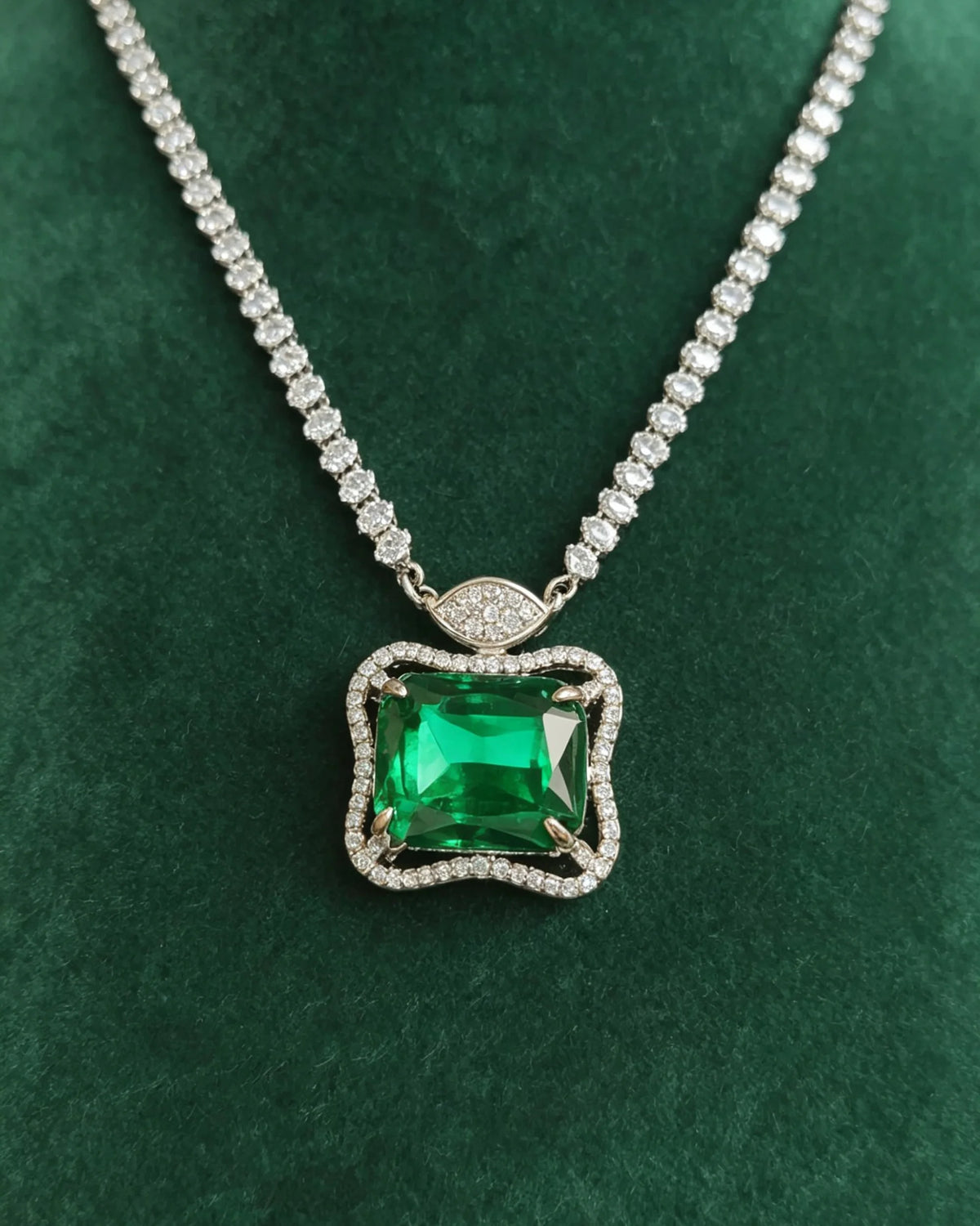 Close view of the Ruutu pendant, clear-stone linked chain and marquise connector