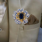 Front view of Sini Midnight Bloom Brooch pinned to a beige suit lapel