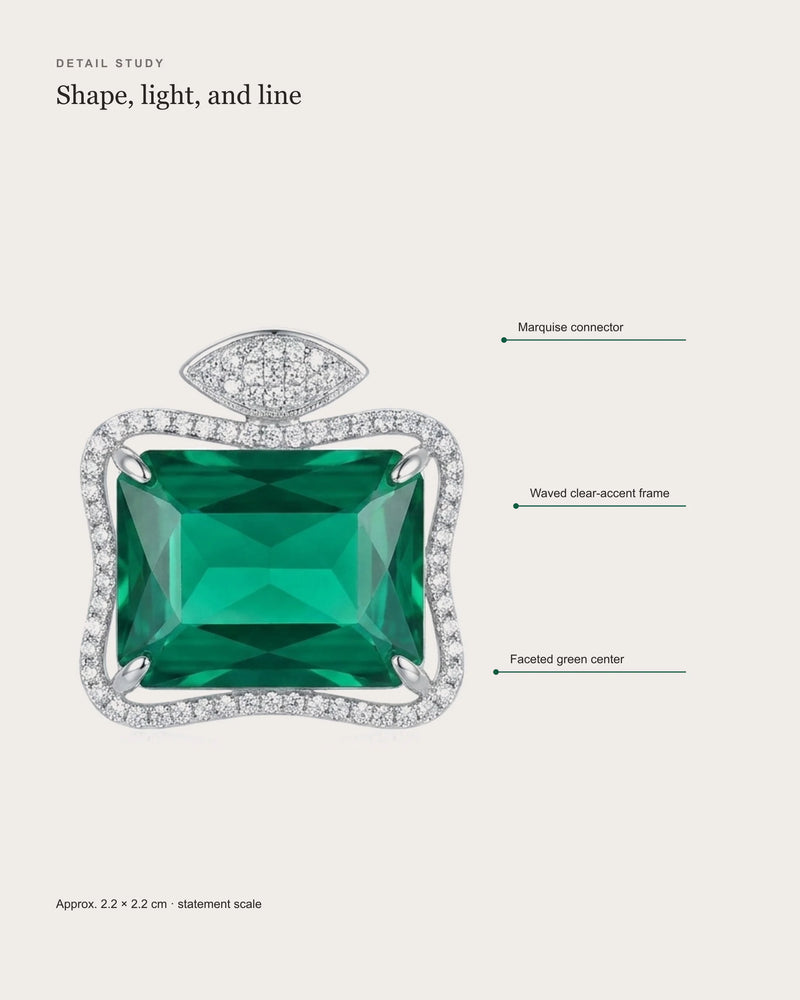 Ruutu earring detail study showing the green center, waved clear-accent frame and marquise connector