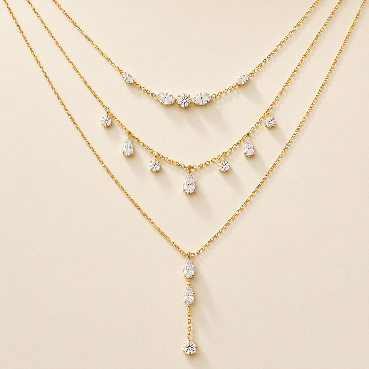 Aurelia Light layered gold crystal necklace on a warm plain background