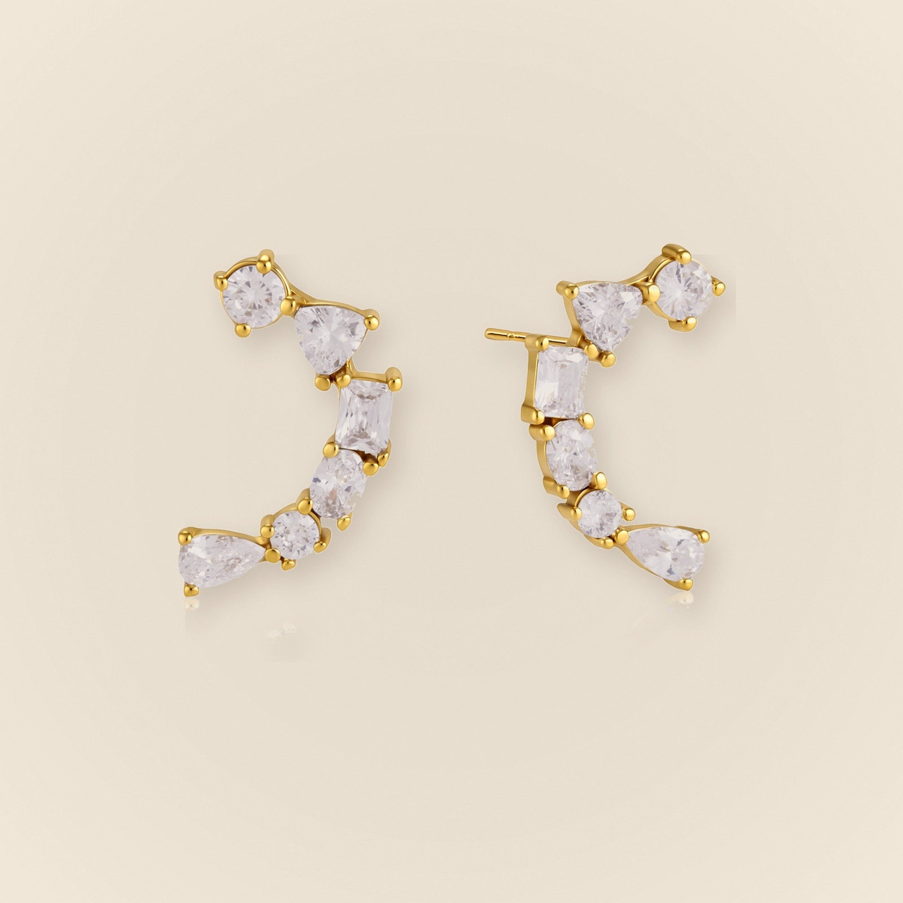 Ilo Smile Pave Stud Earrings on warm neutral background