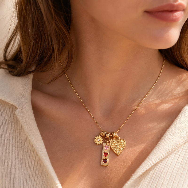 Lempi Daisy Charm Necklace with gold-tone daisy pendant on a fine chain