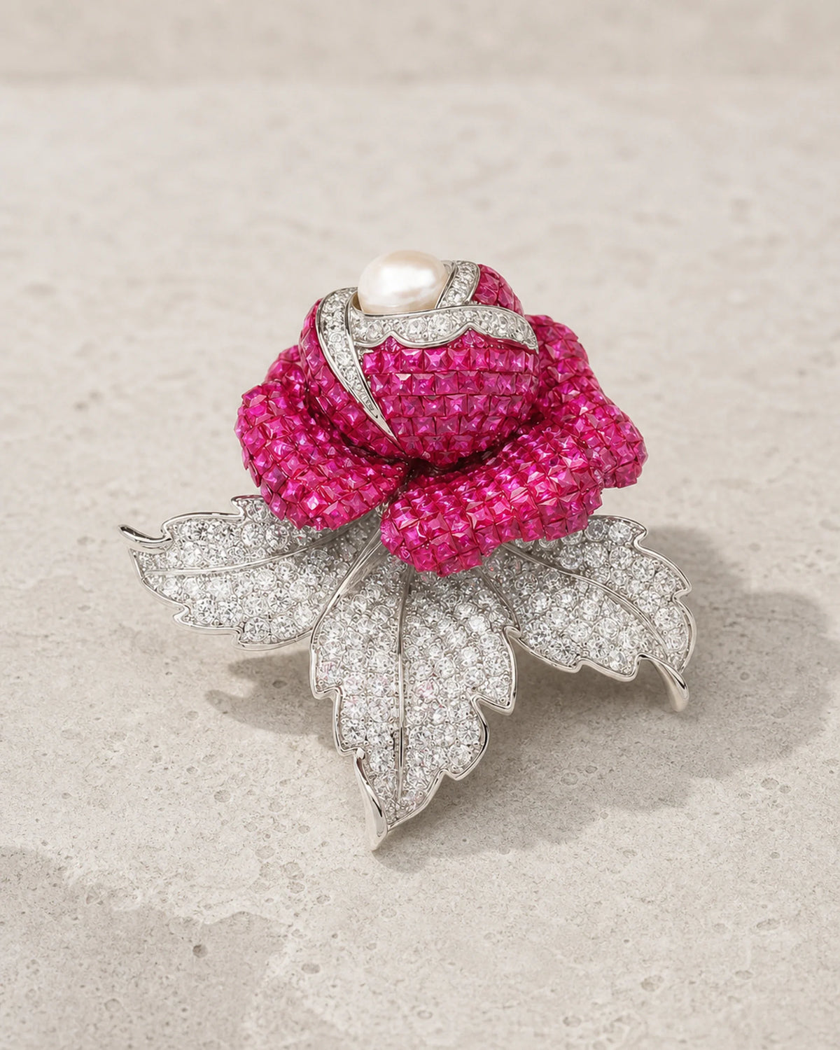 Aava Pearl Crystal Rose Brooch in silver tone and fuchsia on limestone