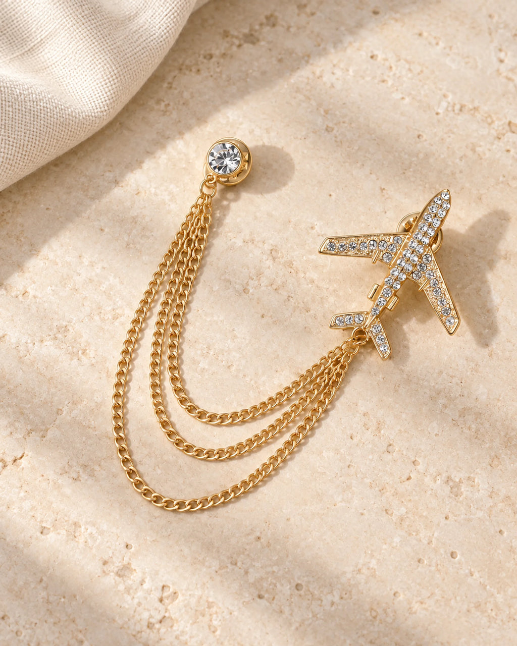 Aero Airplane Lapel Chain Brooch in gold-tone finish; still-life view showing the full drape