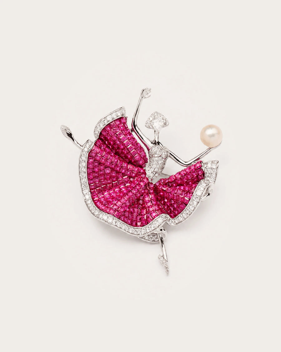 Aila Crystal Ballerina Brooch in silver tone and fuchsia on a continuous warm pale background