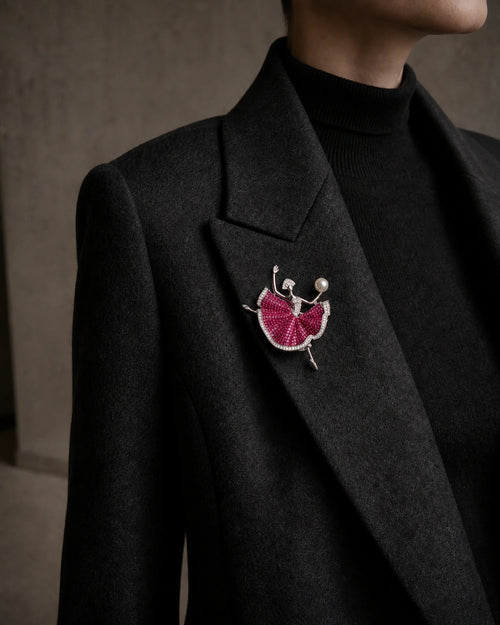 Aila ballerina brooch at its true 5.8 by 7.0 centimetre scale on a charcoal blazer lapel