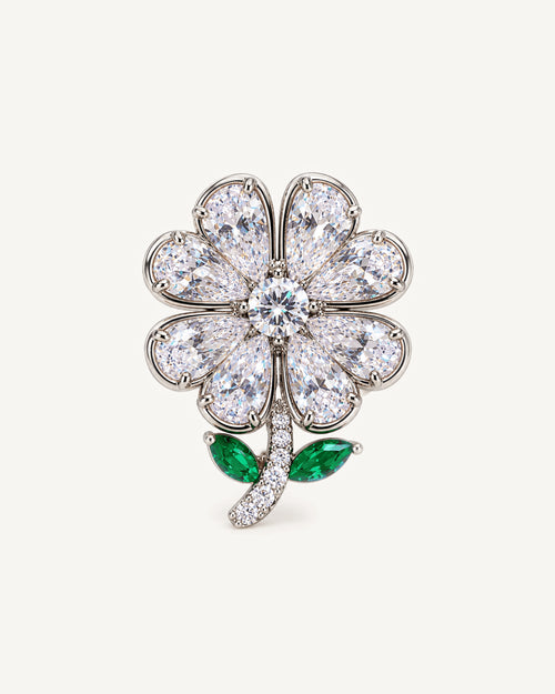 Aili Clear Zircon Clover Brooch shown complete on a warm plain background.