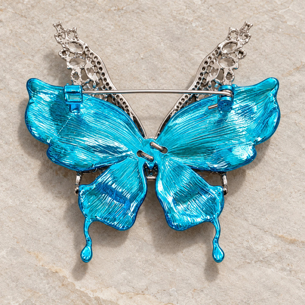 Rear view of Airi brooch showing textured turquoise wing backs, horizontal pin and safety catch.
