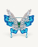 Front view of Airi Layered Blue Butterfly Brooch with turquoise sculpted wings, clear raised wings and two teardrop tails.