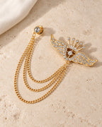 Alar Winged Crown Lapel Chain Brooch in gold-tone finish; still-life view showing the full drape