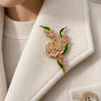 Alva Pink Zircon Rose Brooch pinned completely inside one broad ivory wool lapel.
