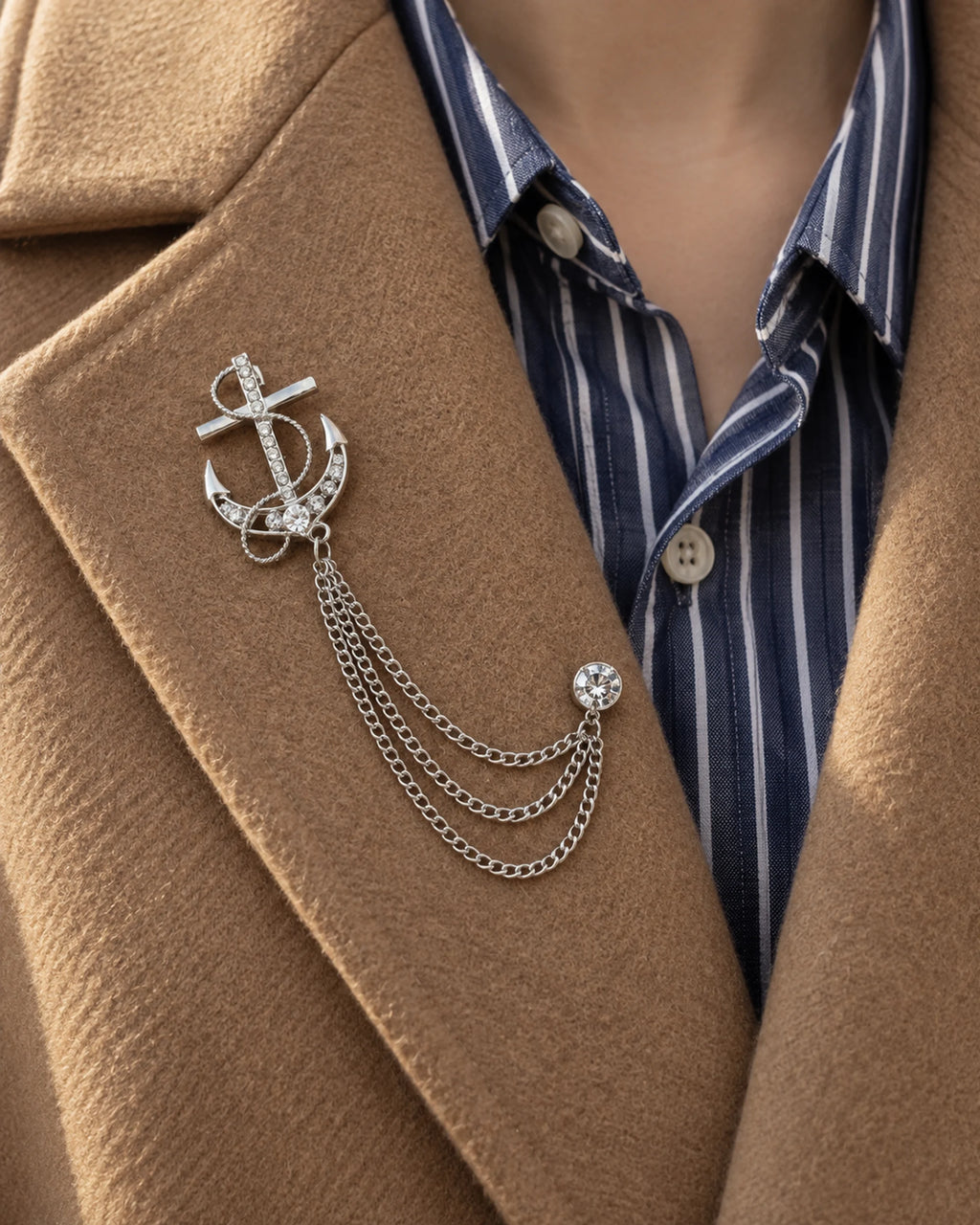 Ankkuri Anchor Lapel Chain Brooch in silver-tone finish; close wearing view on a structured lapel