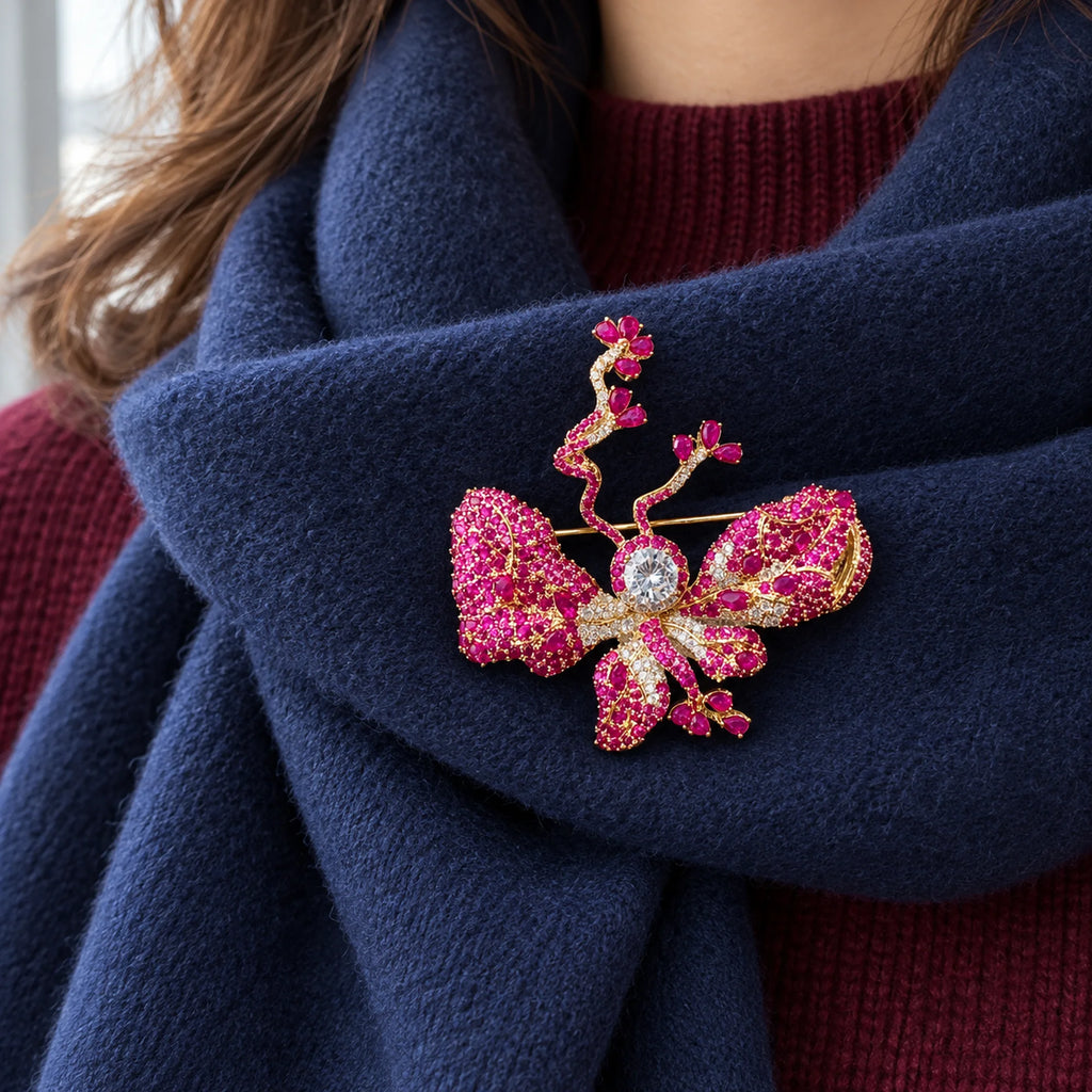 A doubled navy scarf supports the butterfly and its curling floral tips.