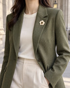 Auri Ivory Camellia Magnetic Brooch, Gold & Ivory worn with a olive blazer, wider styling view