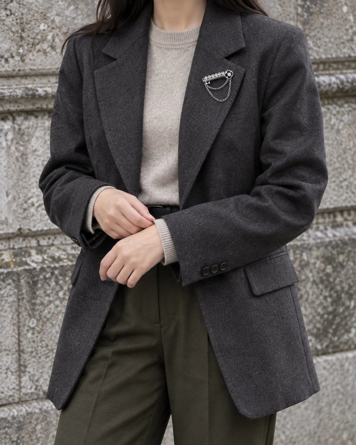 Avain Key Double Chain Brooch in silver-tone finish — wider wearing view with neutral tailoring