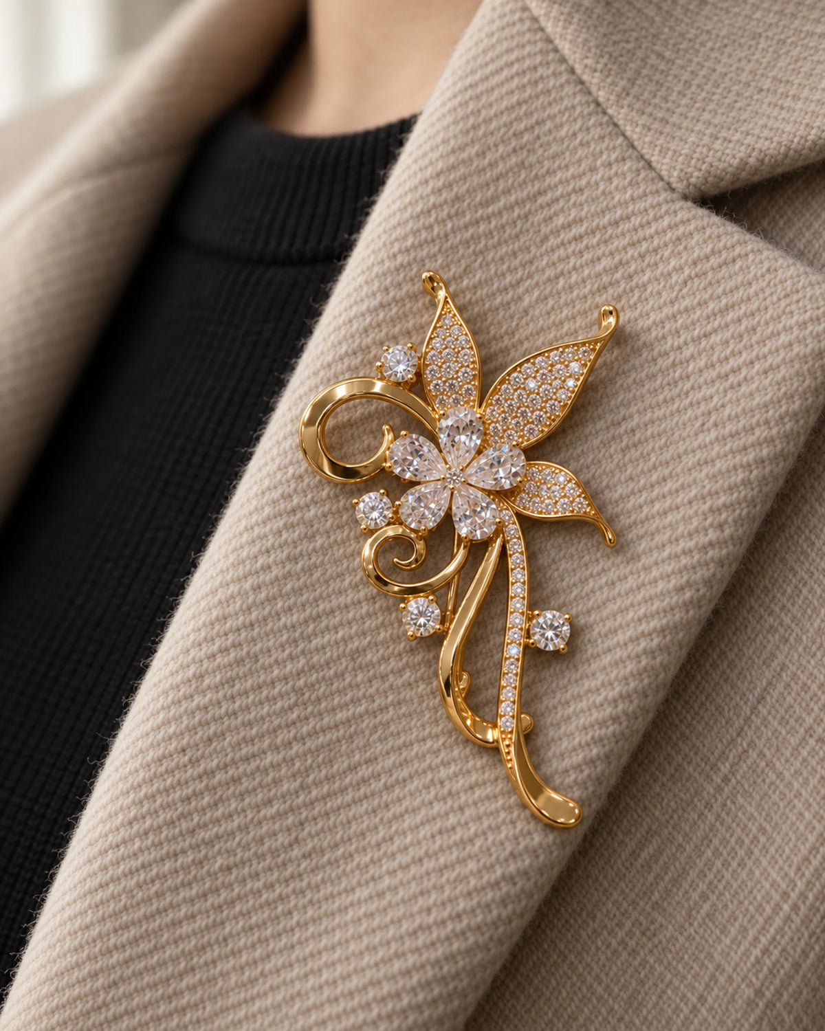 Avelia pinned inside an oatmeal wool blazer lapel, close wearing view