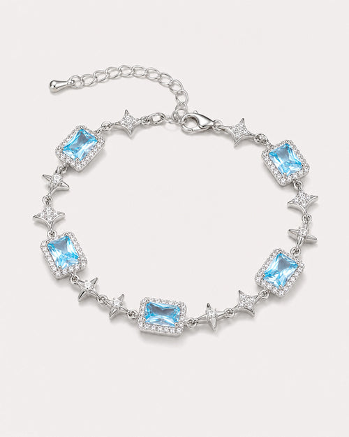 Celeste Blue Zircon Star Bracelet arranged on a warm #F0EBE9 studio background with natural contact shadow.