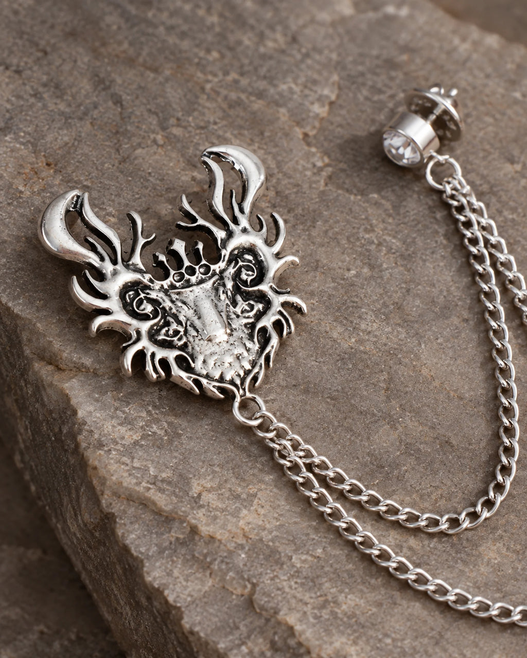 Draka Horned Crest Lapel Chain Brooch in silver-tone finish; motif and chain detail