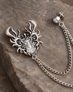 Draka Horned Crest Lapel Chain Brooch in silver-tone finish; motif and chain detail