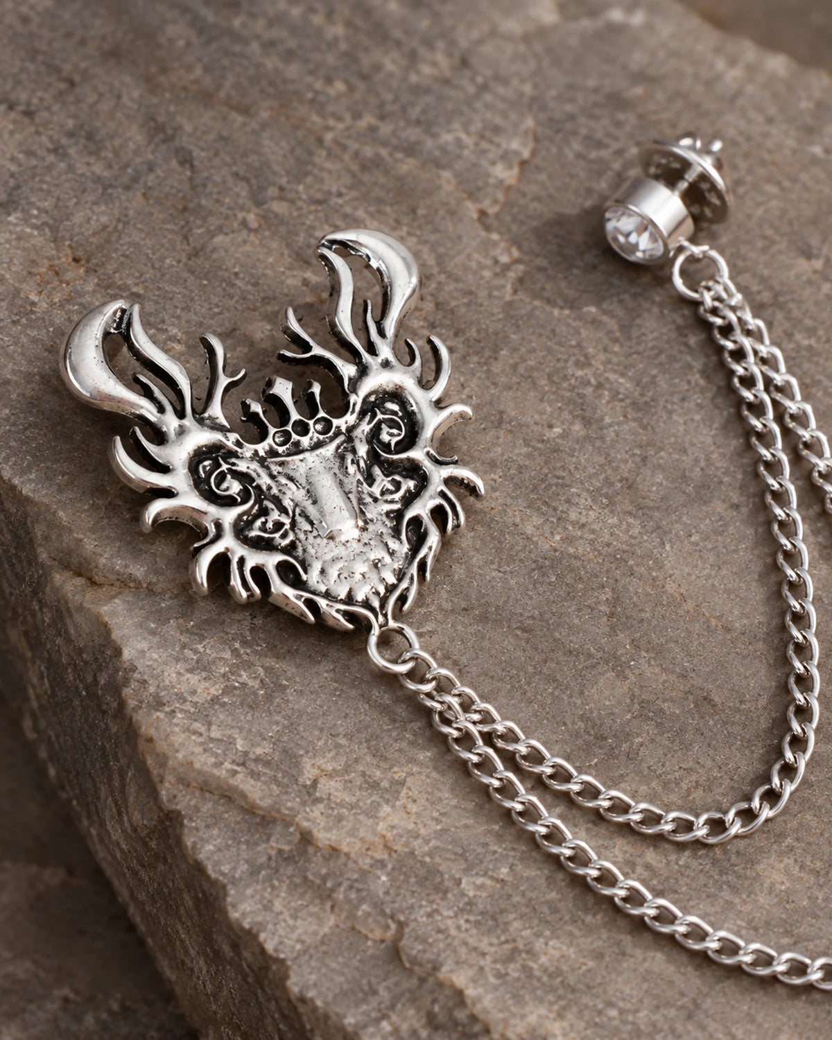 Draka Horned Crest Lapel Chain Brooch in silver-tone finish; motif and chain detail