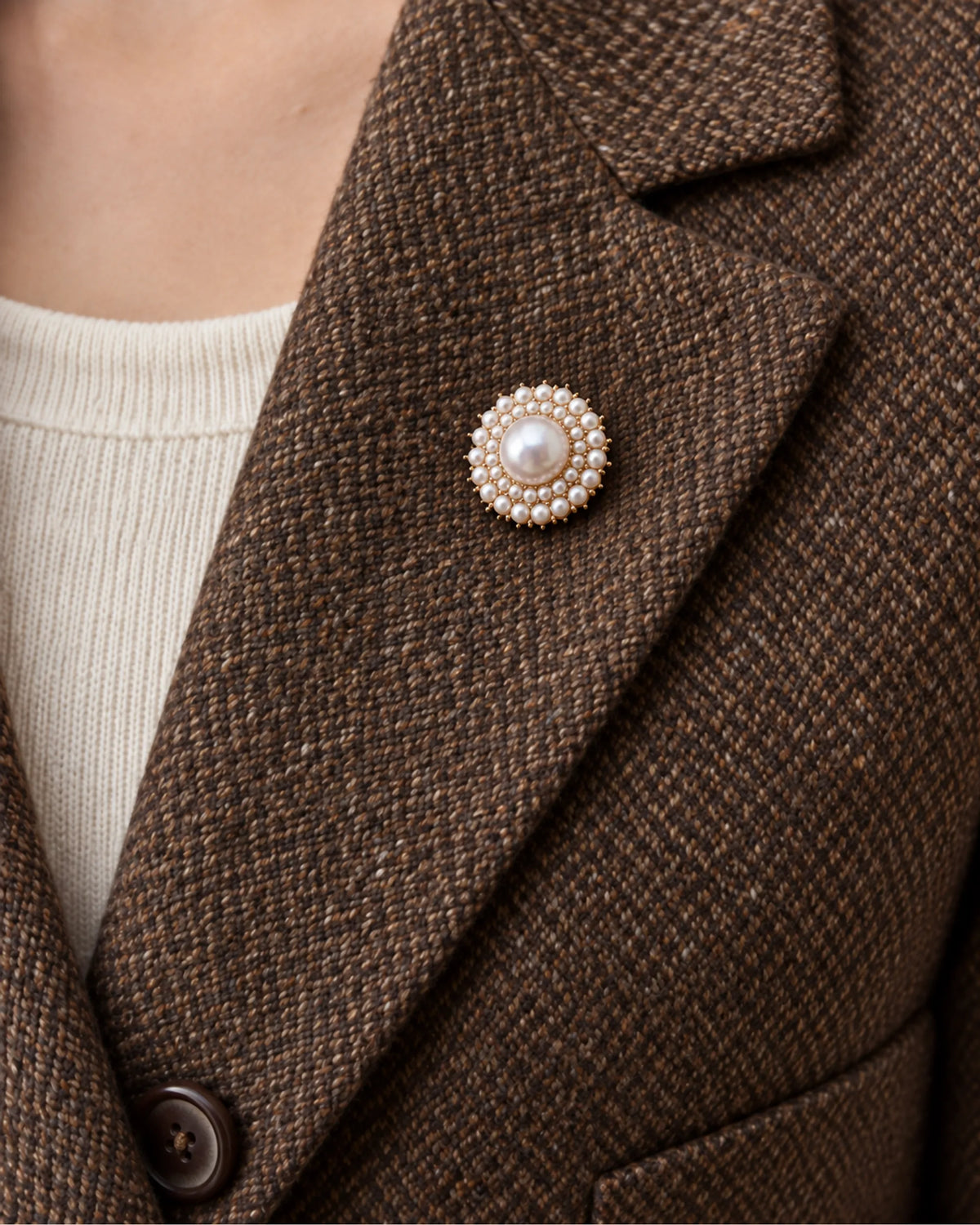 Elin Round Pearl-Style Cluster Brooch — model wearing the brooch on a jacket lapel, close view