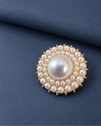 Elin Round Pearl-Style Cluster Brooch — front display on folded slate-blue paper