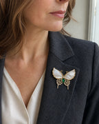 Close lapel view of the Elina Green Shell Butterfly Brooch worn at its natural 4.2 cm width.