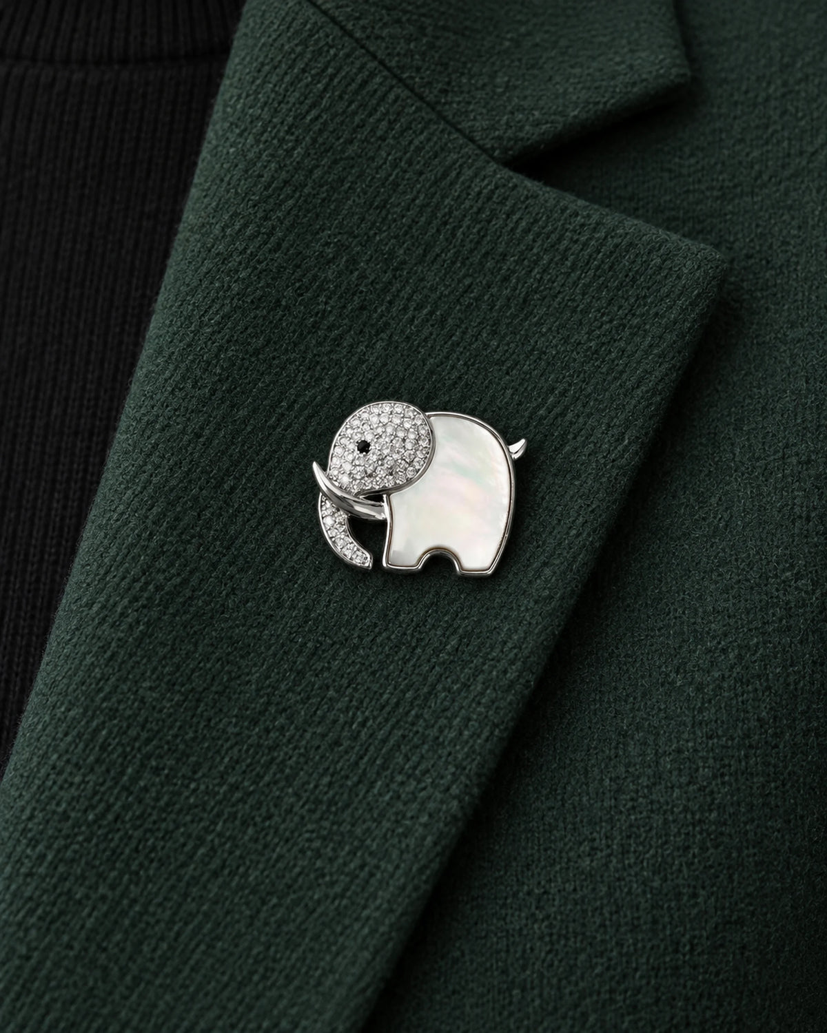 Elli Shell Elephant Magnetic Brooch, Silver & White worn on a green jacket lapel, close view