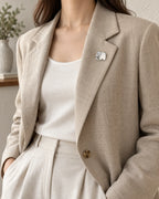 Elli Shell Elephant Magnetic Brooch, Silver & White worn with a pale jacket, wider styling view