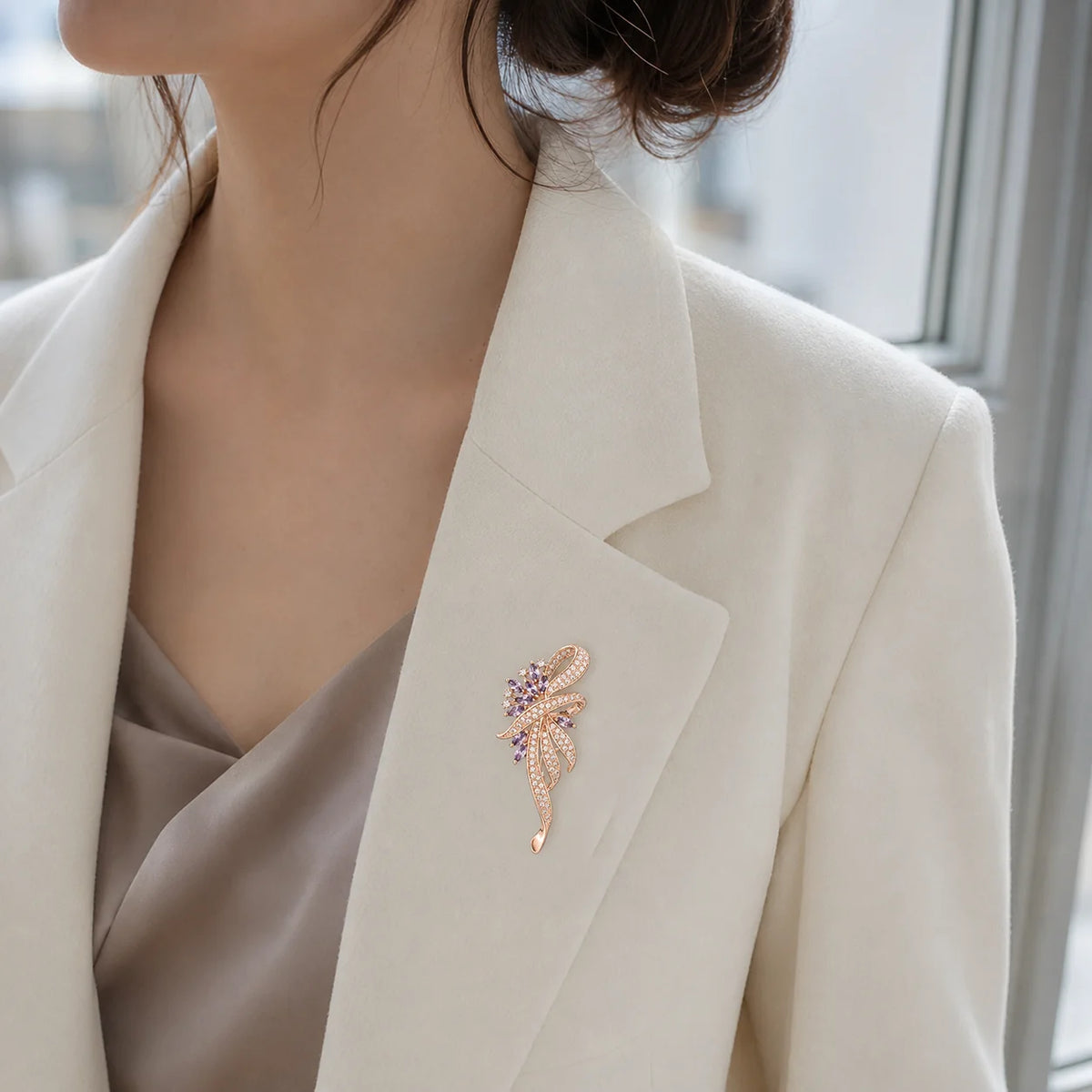 Rose gold and lavender Elowen Crystal Spray Brooch worn at true 6.2 cm scale on an ivory blazer