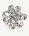 Silver-tone Elva crystal ribbon rosette brooch with interwoven pavé and baguette zircon bands