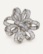 Silver-tone Elva crystal ribbon rosette brooch with interwoven pavé and baguette zircon bands