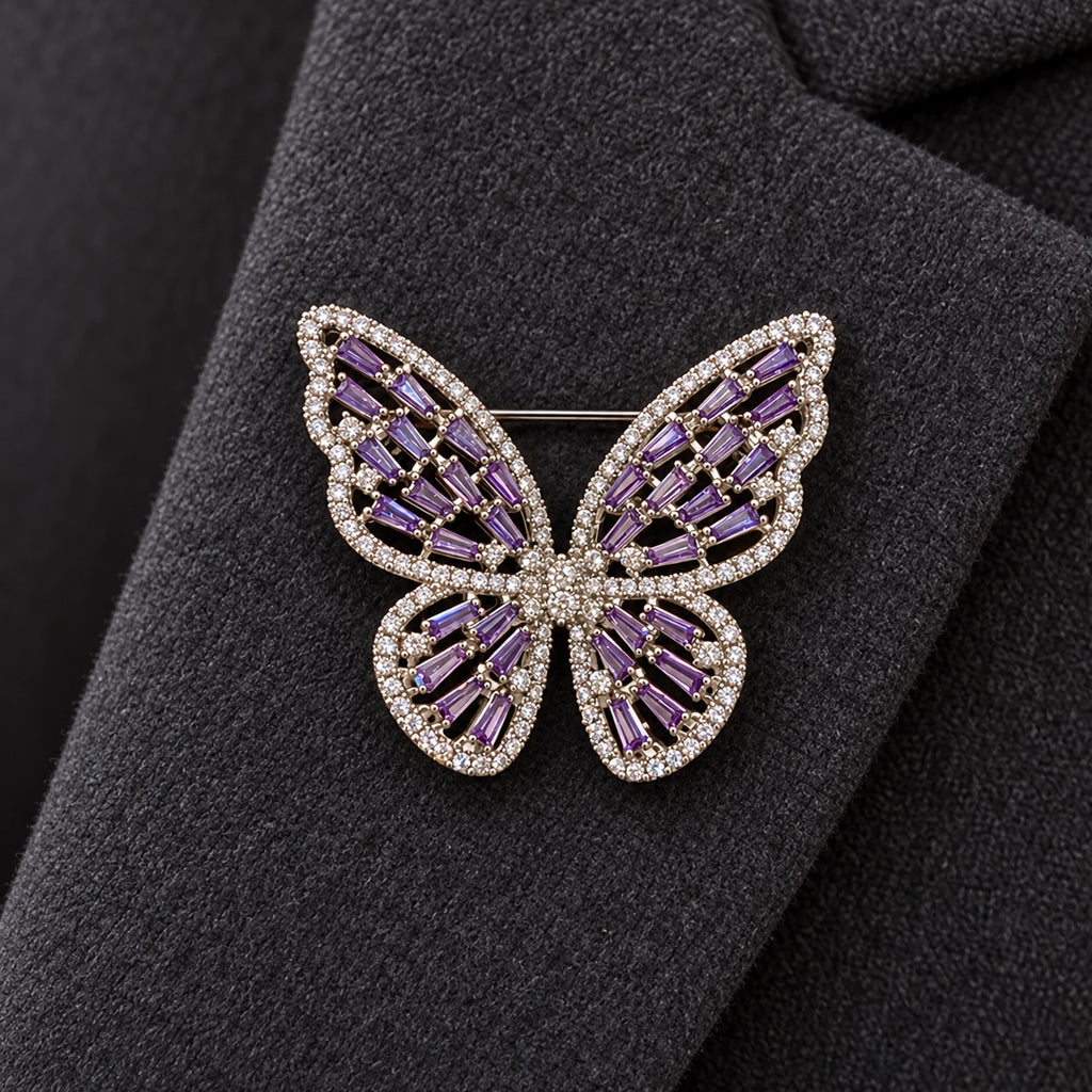 The Silver & Purple butterfly sits within one broad charcoal wool lapel.