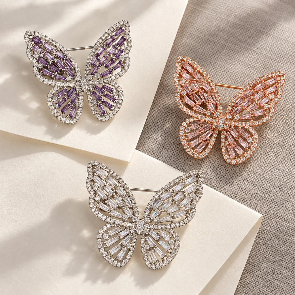 Enni butterfly brooch in three color choices: Silver & Purple, Rose Gold & Pink and Silver & Clear.