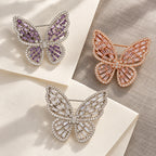 Enni butterfly brooch in three color choices: Silver & Purple, Rose Gold & Pink and Silver & Clear.