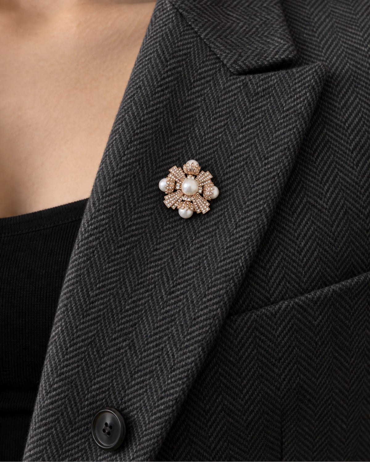 Estrid Pearl-Style Star Cross Brooch — model wearing the brooch on a jacket lapel, close view