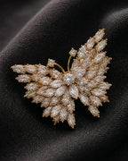 Macro view of Eveli Butterfly Brooch marquise crystals, central body and fine gold-tone setting
