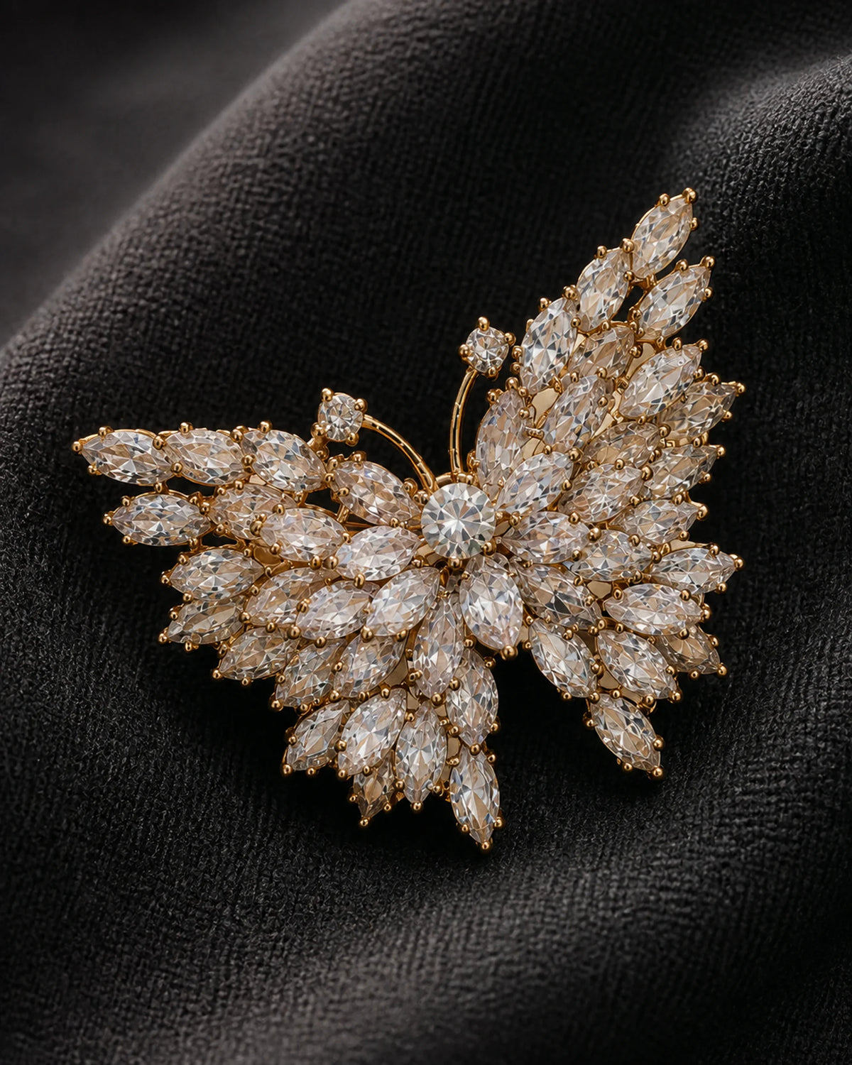 Macro view of Eveli Butterfly Brooch marquise crystals, central body and fine gold-tone setting